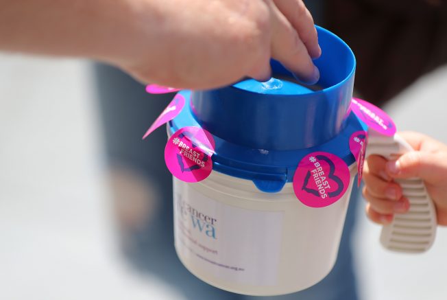 Donating to Breast Cancer Care WA - donation jar