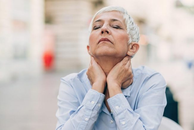 woman experiencing symptoms of menopause